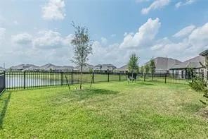 a view of a park and a large trees