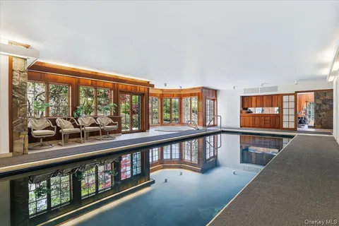 wooden floor in a living room with a large window