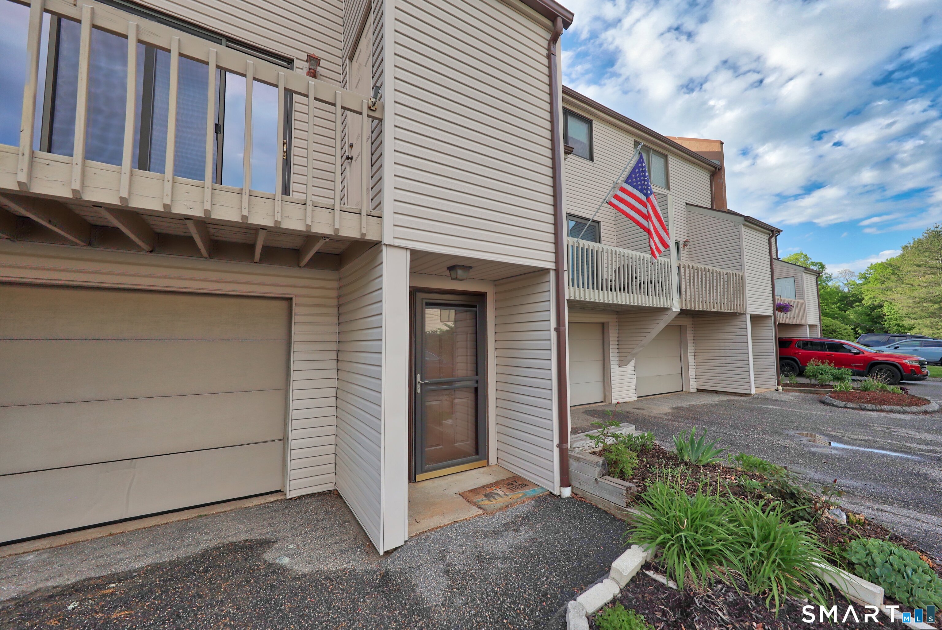 349 Allen Road, Unit 34C Torrington, CT 06790 - Photo 2 of 31 a front view of a house with garage