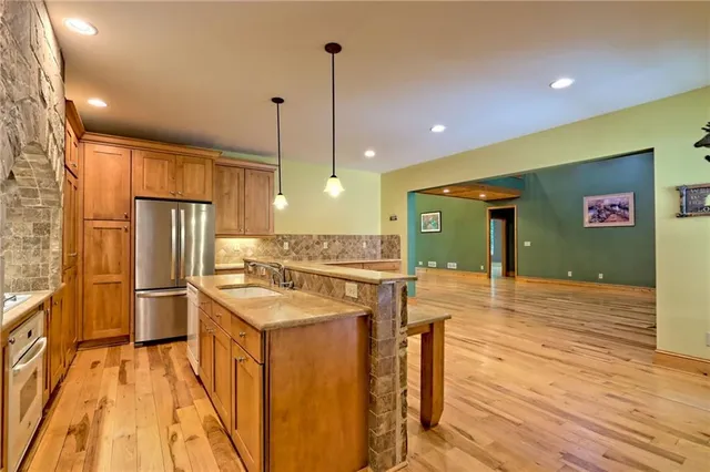 a view of front door of house with wooden floor