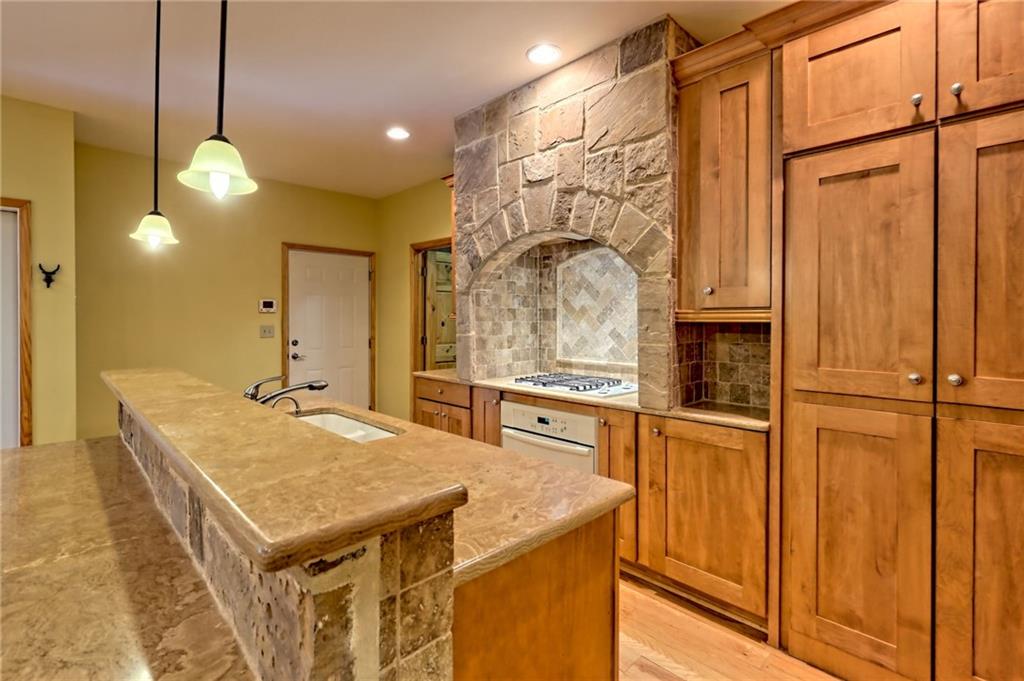 876 Whitetail Trail Clayton, GA 30525 - Photo 13 of 85 a kitchen with stainless steel appliances granite countertop a sink a refrigerator and a stove