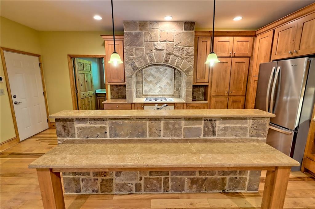 876 Whitetail Trail Clayton, GA 30525 - Photo 14 of 85 a bathroom with a sink a mirror and a shower