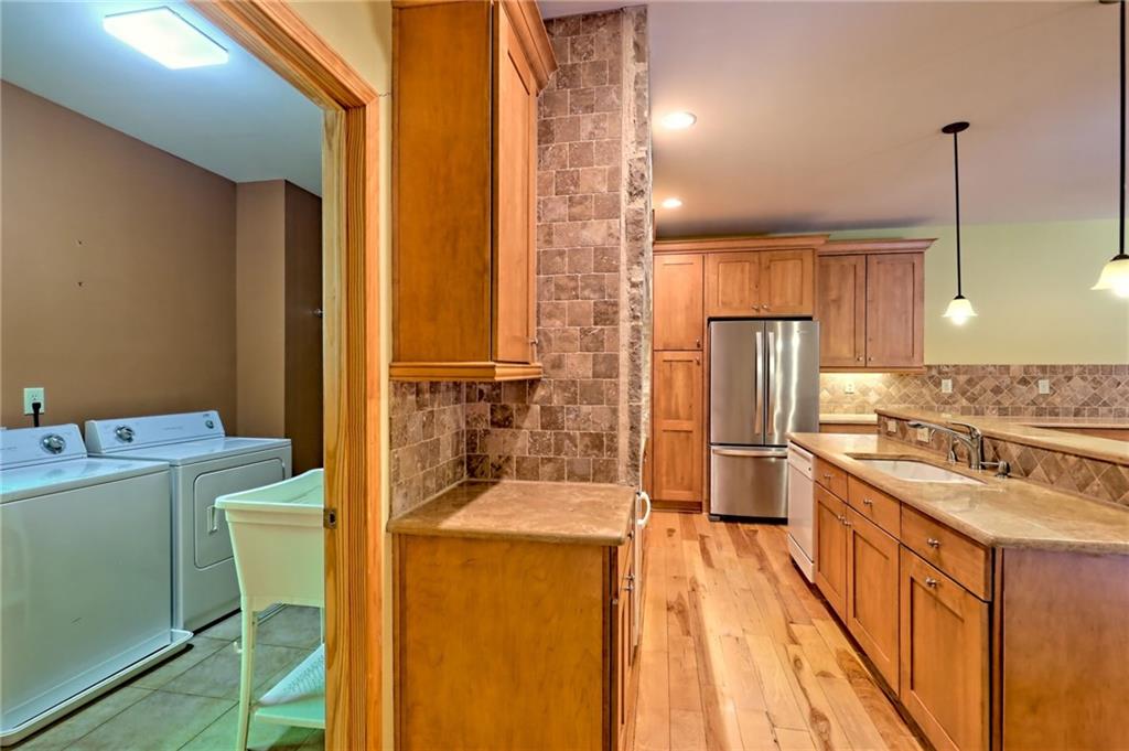 876 Whitetail Trail Clayton, GA 30525 - Photo 15 of 85 a kitchen with a refrigerator a stove top oven and a sink