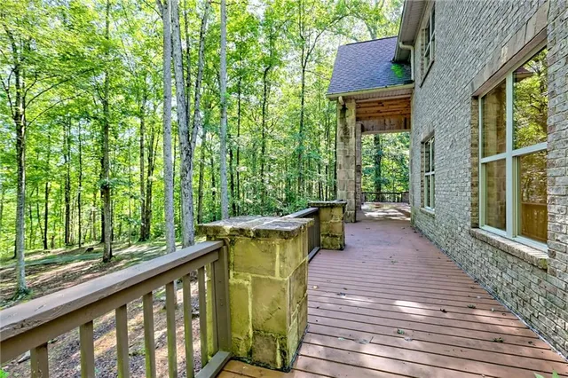 a view of a bathroom with shower and wooden floor