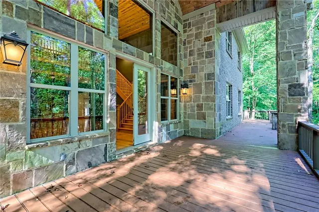 a view of an empty room with a ceiling fan