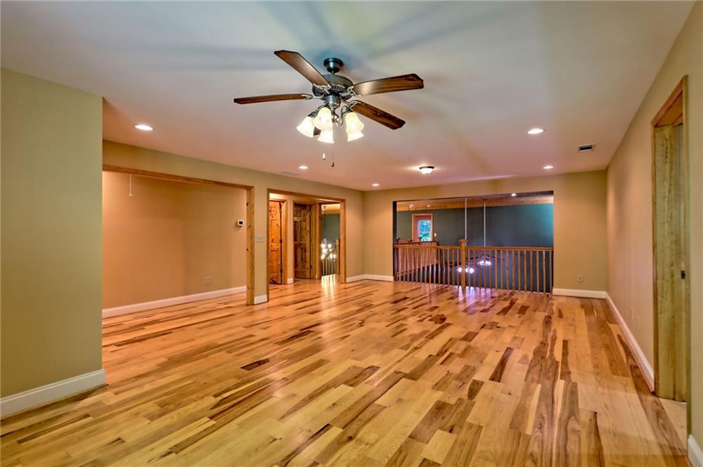 876 Whitetail Trail Clayton, GA 30525 - Photo 47 of 85 a view of an empty room with a ceiling fan