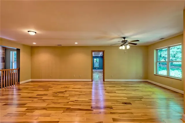a view of a lush green hillside and a houses