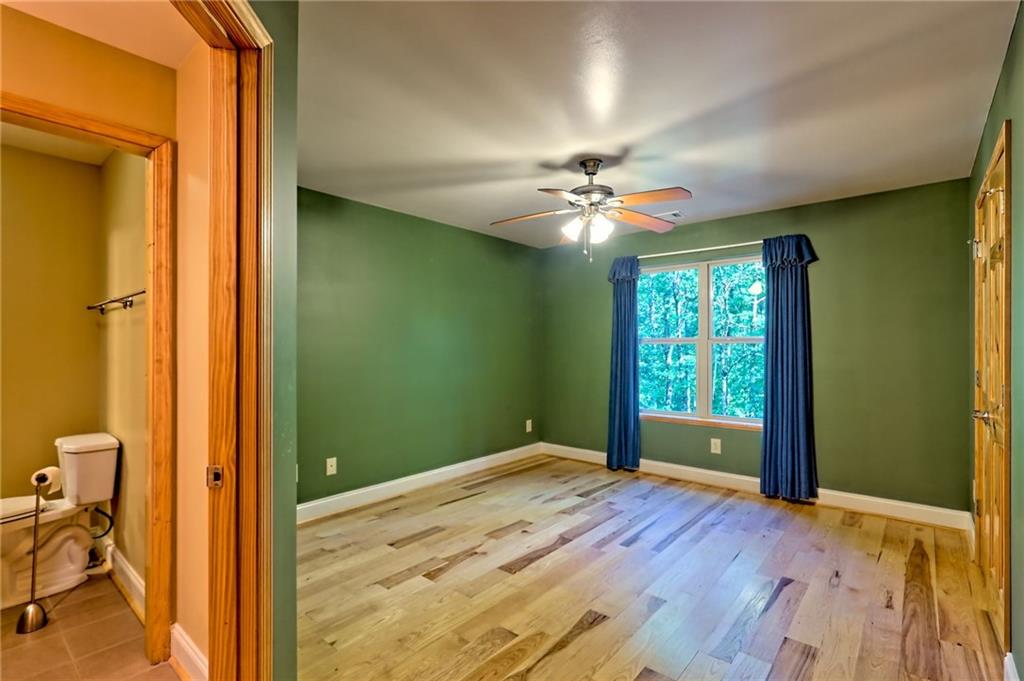 876 Whitetail Trail Clayton, GA 30525 - Photo 56 of 85 wooden floor in an empty room with a window