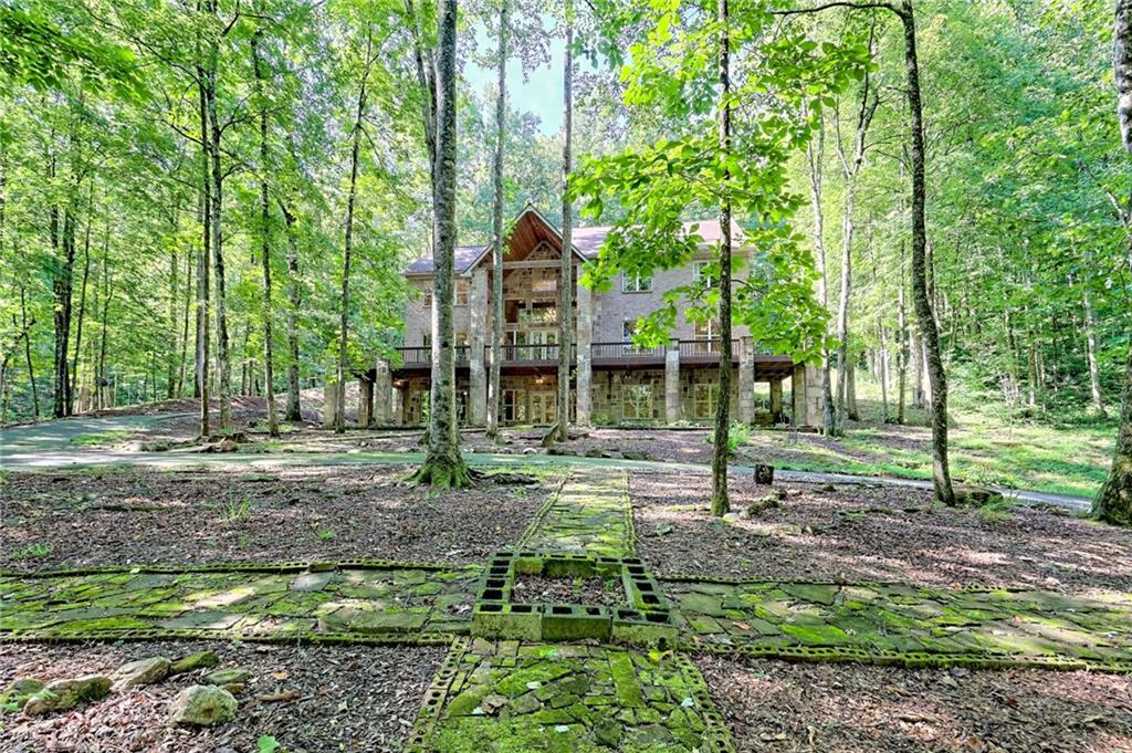 876 Whitetail Trail Clayton, GA 30525 - Photo 79 of 85 a backyard of a house with lots of green space