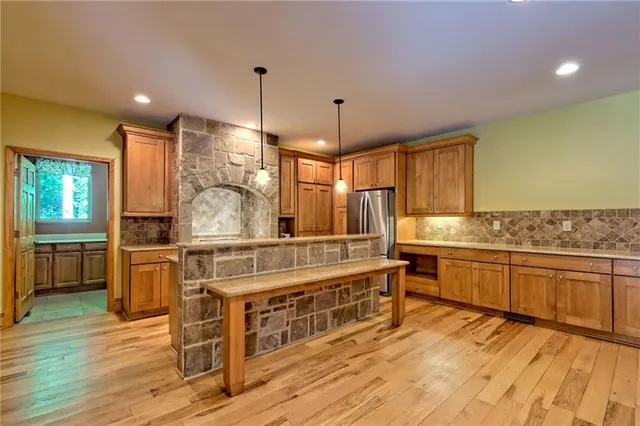 a bathroom with a sink a mirror and a shower