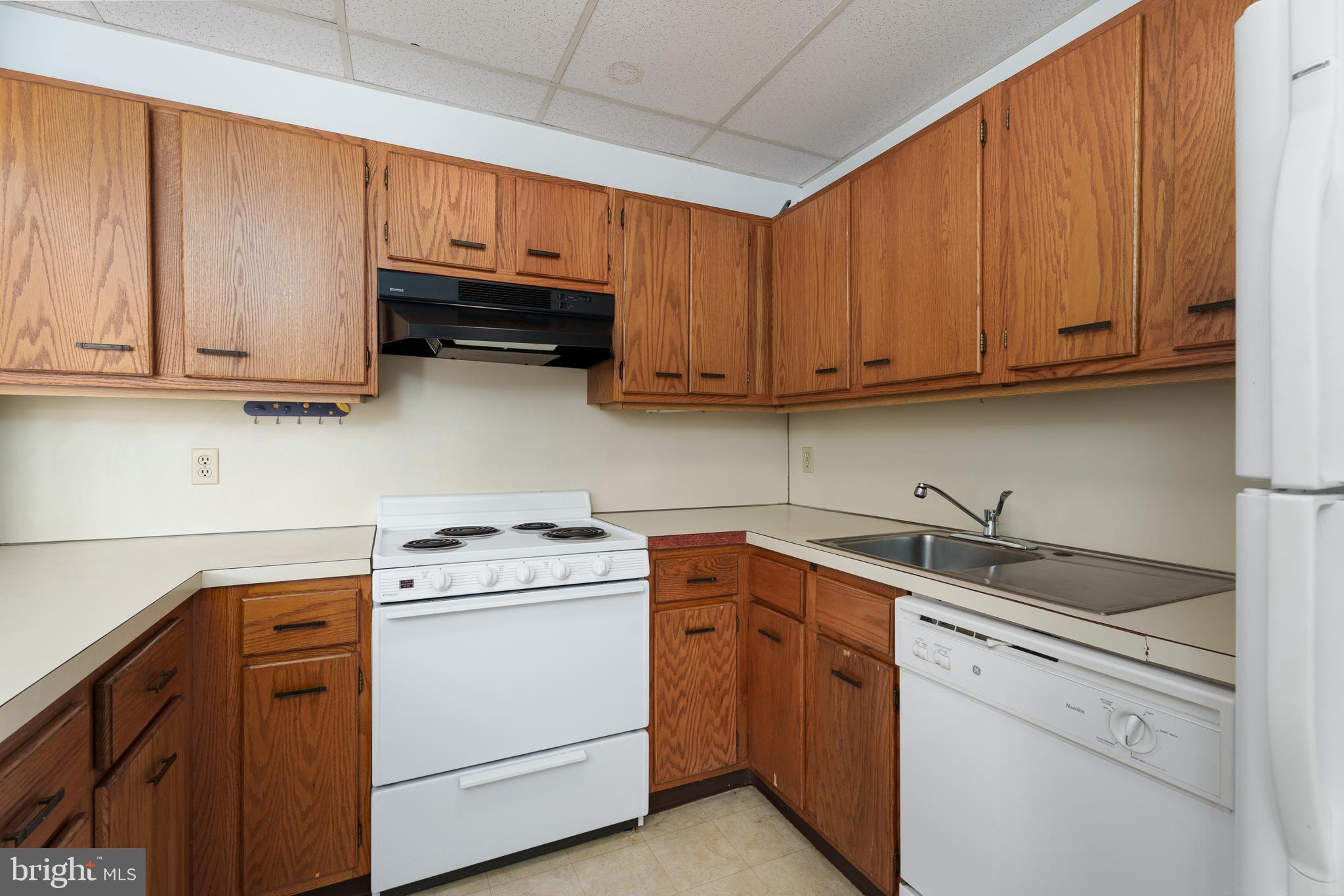 1 Markham Road, Unit 2C Princeton, NJ 08540 - Photo 13 of 23 a kitchen with cabinets appliances a sink and a counter top