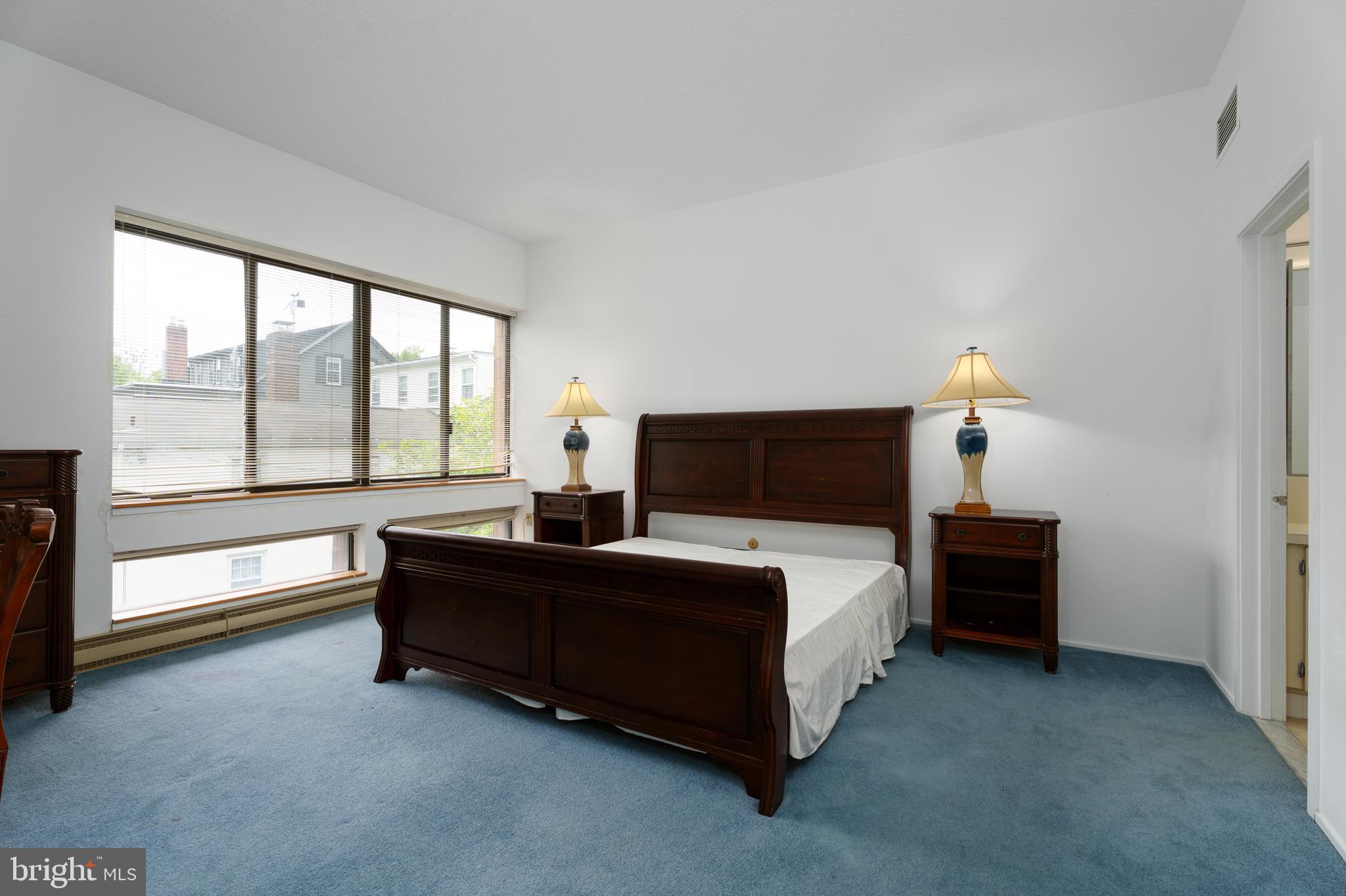 1 Markham Road, Unit 2C Princeton, NJ 08540 - Photo 14 of 23 a spacious bedroom with a bed and a couch