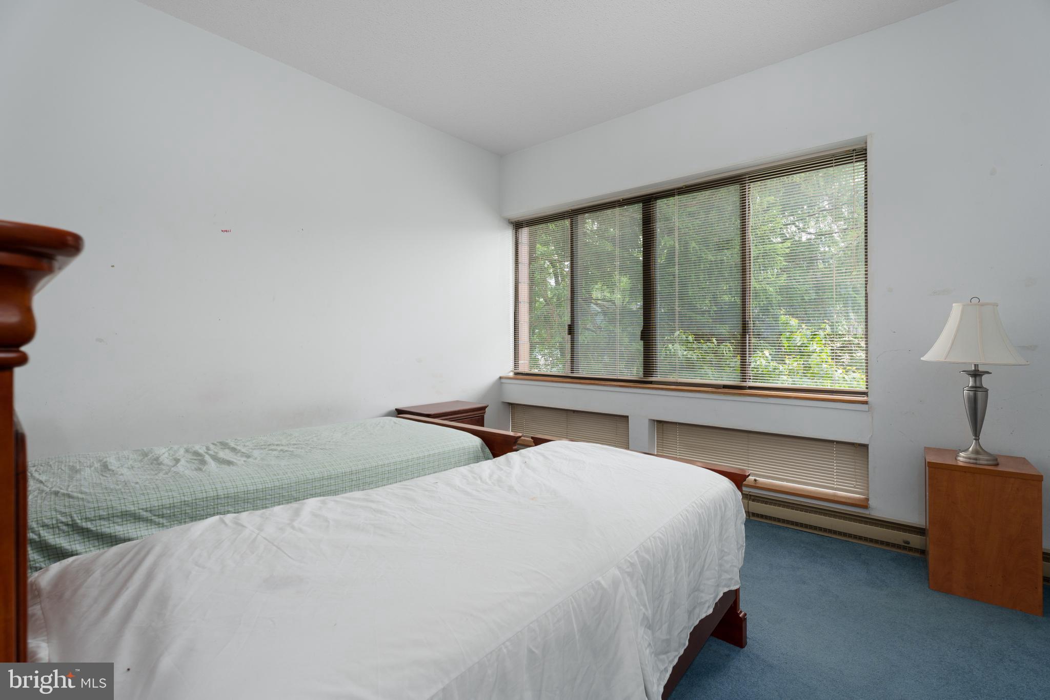 1 Markham Road, Unit 2C Princeton, NJ 08540 - Photo 18 of 23 a bedroom with a large bed and a large window