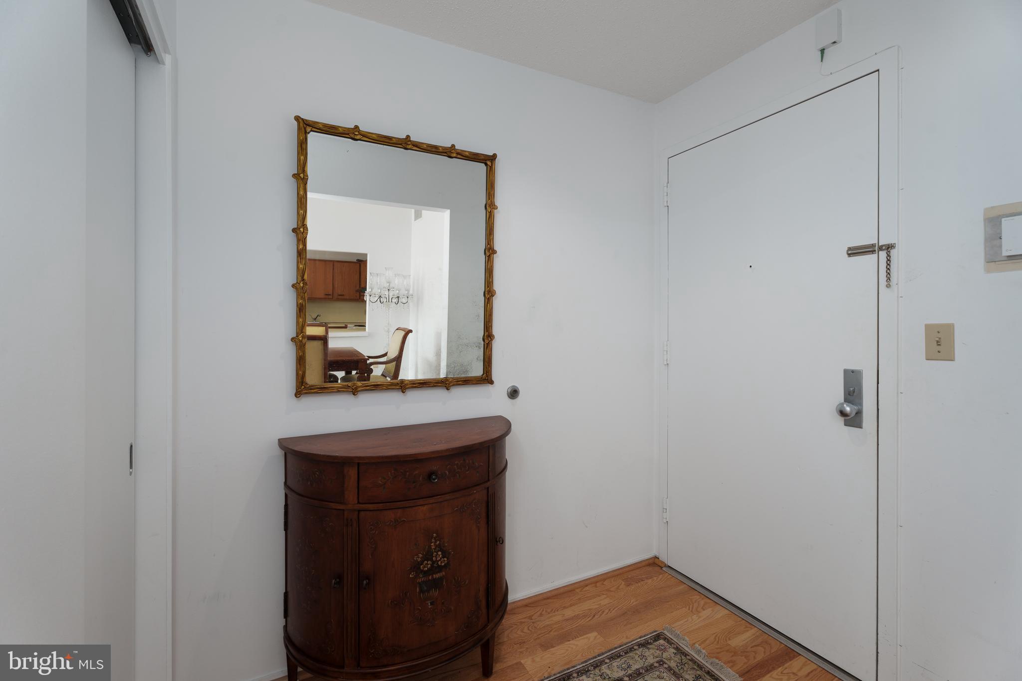 1 Markham Road, Unit 2C Princeton, NJ 08540 - Photo 3 of 23 a room with a table and a mirror