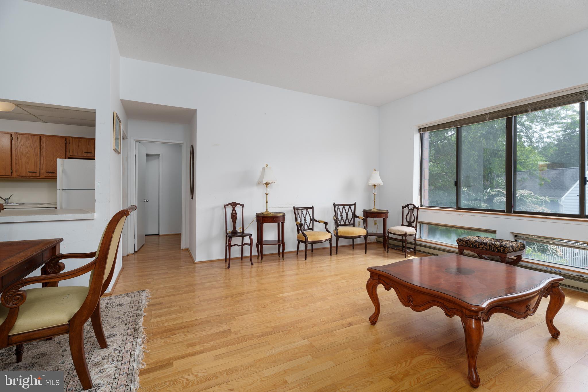 1 Markham Road, Unit 2C Princeton, NJ 08540 - Photo 6 of 23 a living room with furniture pool table and large windows