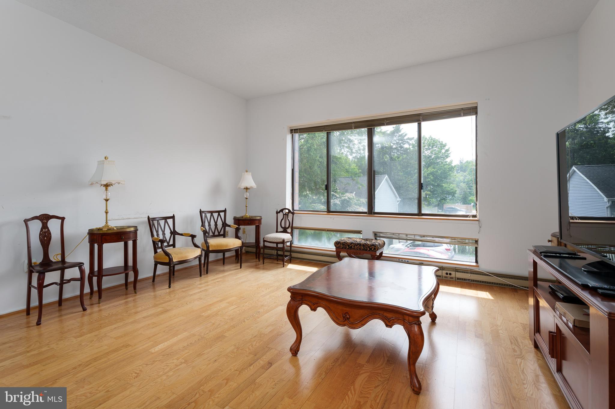 1 Markham Road, Unit 2C Princeton, NJ 08540 - Photo 7 of 23 a living room with furniture pool table and a flat screen tv