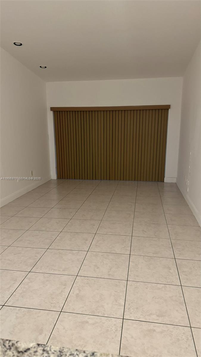 9636 Southwest 147th Court Miami, FL 33196 - Photo 11 of 37 a view of a livingroom with an empty space and a rug