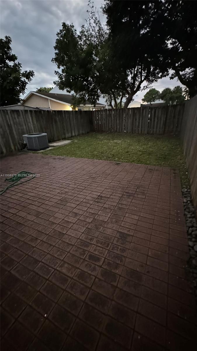 9636 Southwest 147th Court Miami, FL 33196 - Photo 13 of 37 a view of a yard with an iron fence