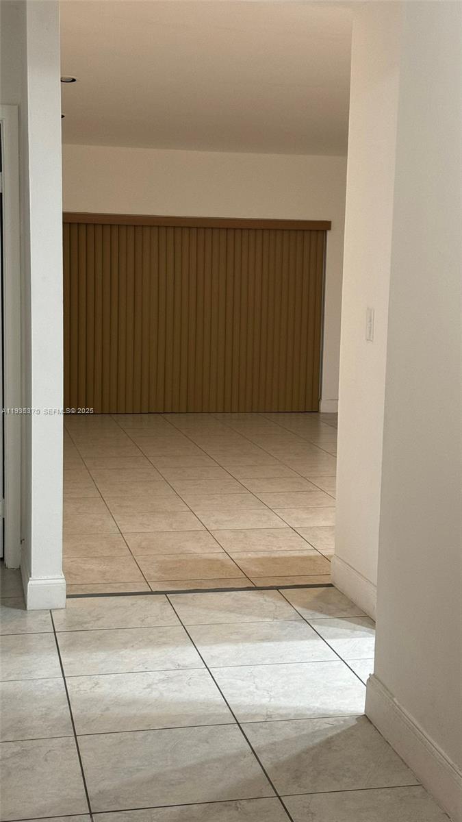 9636 Southwest 147th Court Miami, FL 33196 - Photo 29 of 37 an empty room with a bench