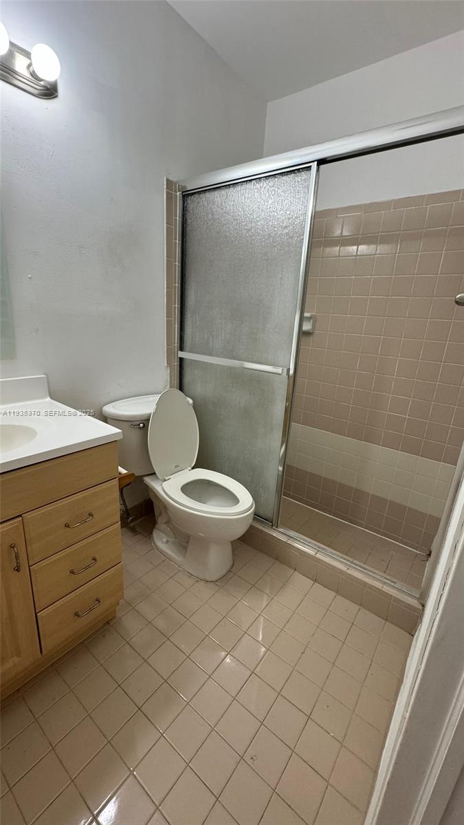 9636 Southwest 147th Court Miami, FL 33196 - Photo 5 of 37 a bathroom with a toilet and a shower
