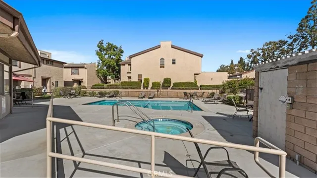 a view of a patio with swimming pool