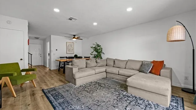 a living room with furniture rug and window