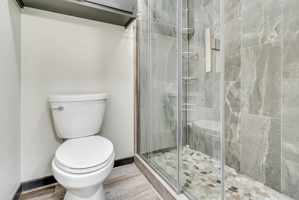 104 Rio Vista Road Burnet, TX 78611 - Photo 11 of 30 a bathroom with a toilet and shower