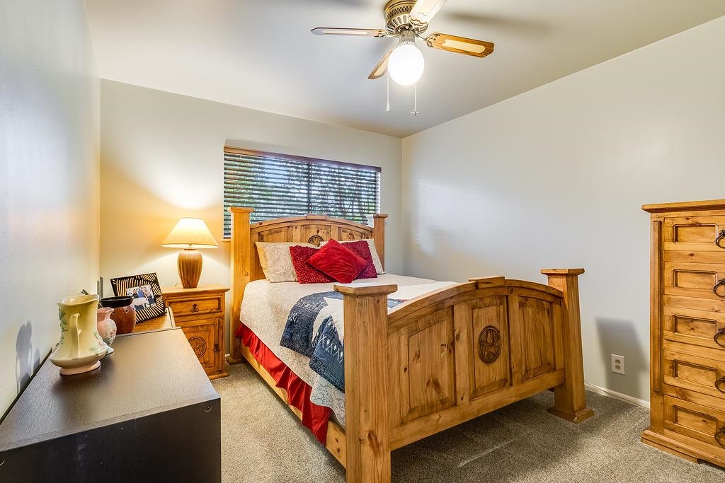 104 Rio Vista Road Burnet, TX 78611 - Photo 13 of 30 a bedroom with a bed and window