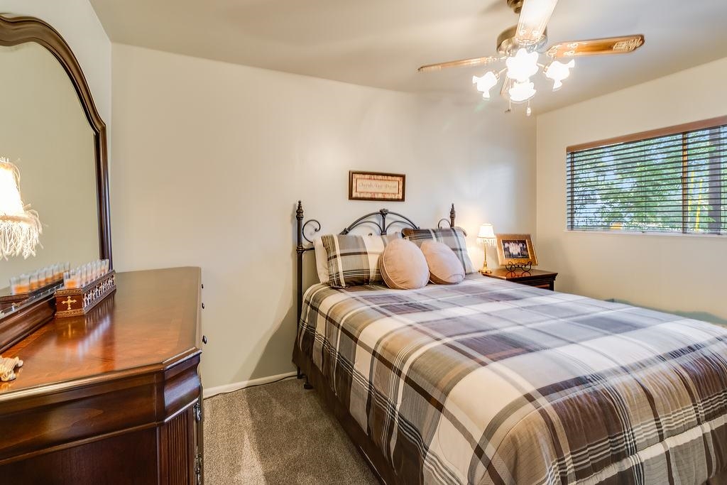 104 Rio Vista Road Burnet, TX 78611 - Photo 15 of 30 a bedroom with a bed and a mirror