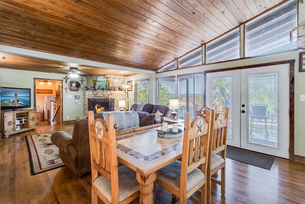 104 Rio Vista Road Burnet, TX 78611 - Photo 20 of 30 a view of a dining room with furniture window and wooden floor
