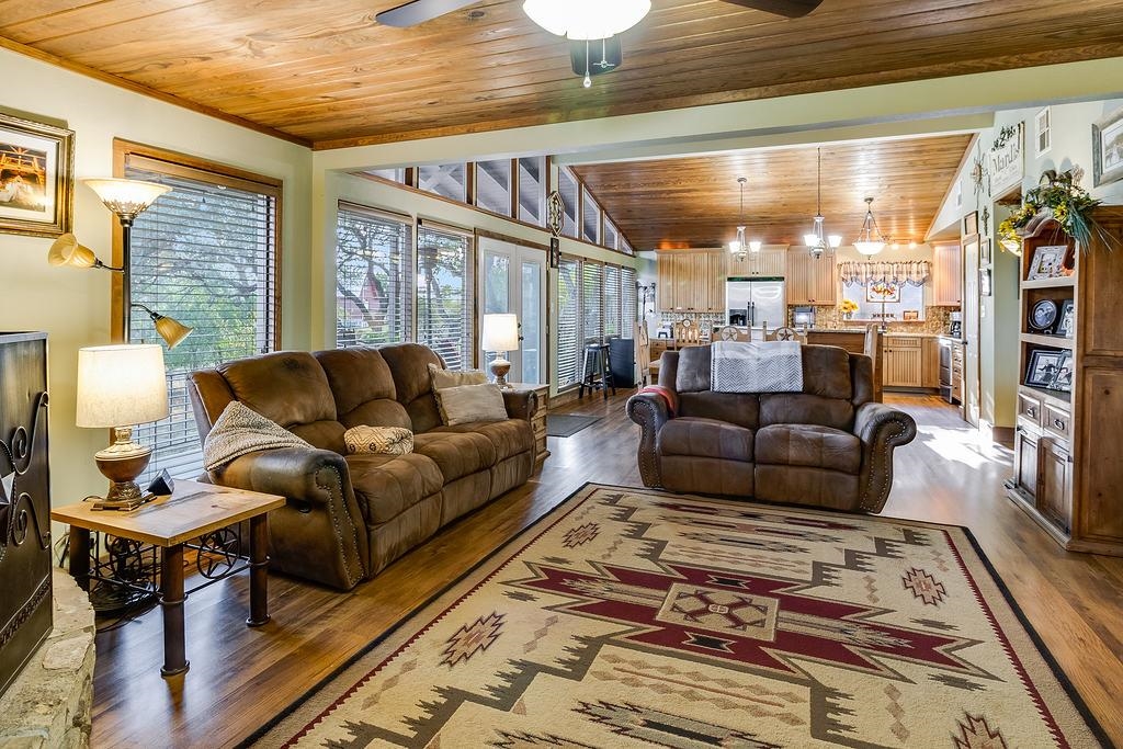 104 Rio Vista Road Burnet, TX 78611 - Photo 22 of 30 a living room with furniture wooden floor and a table