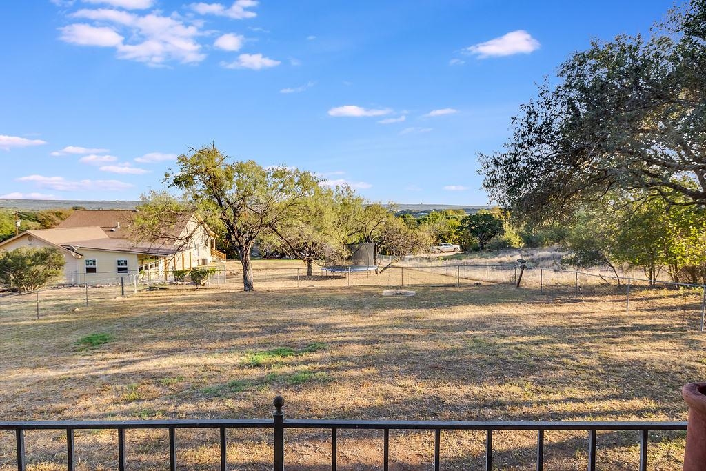 104 Rio Vista Road Burnet, TX 78611 - Photo 24 of 30 a view of a yard next to a building