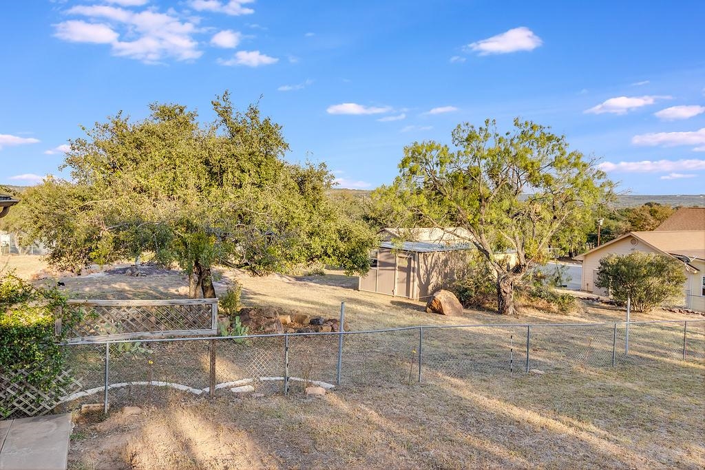 104 Rio Vista Road Burnet, TX 78611 - Photo 25 of 30 a view of a yard with table and chairs