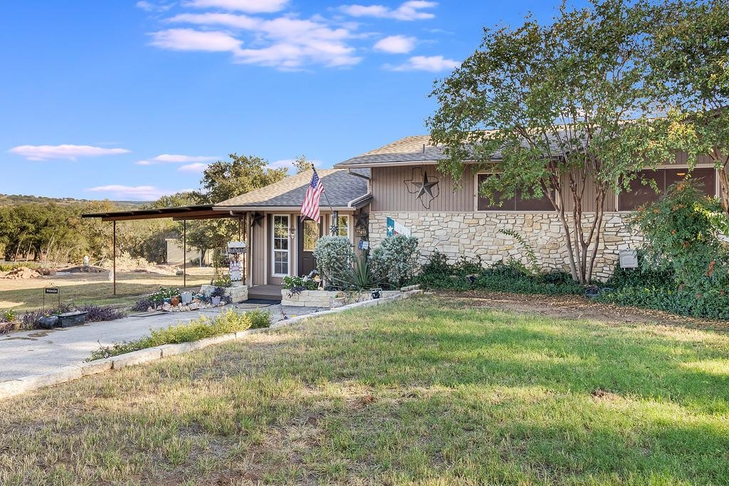 104 Rio Vista Road Burnet, TX 78611 - Photo 4 of 30 a view of a house with backyard and sitting area