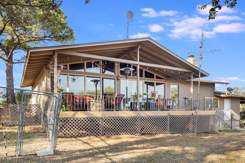 104 Rio Vista Road Burnet, TX 78611 - Photo 5 of 30 a front view of a house with wooden fence