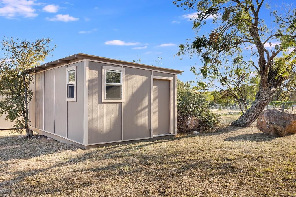 104 Rio Vista Road Burnet, TX 78611 - Photo 6 of 30 a front view of a house with a yard