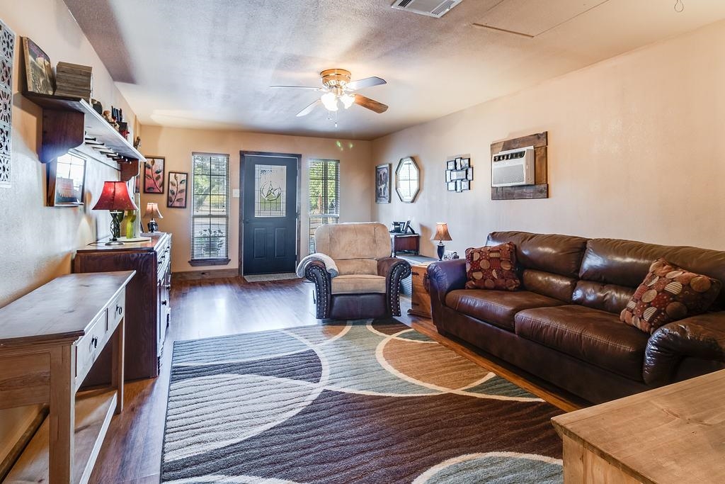 104 Rio Vista Road Burnet, TX 78611 - Photo 8 of 30 a living room with furniture and a rug