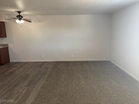 4360 Twin View Circle, Unit 4 Las Vegas, NV 89121 - Photo 1 of 17 Unfurnished living room with ceiling fan and baseboards