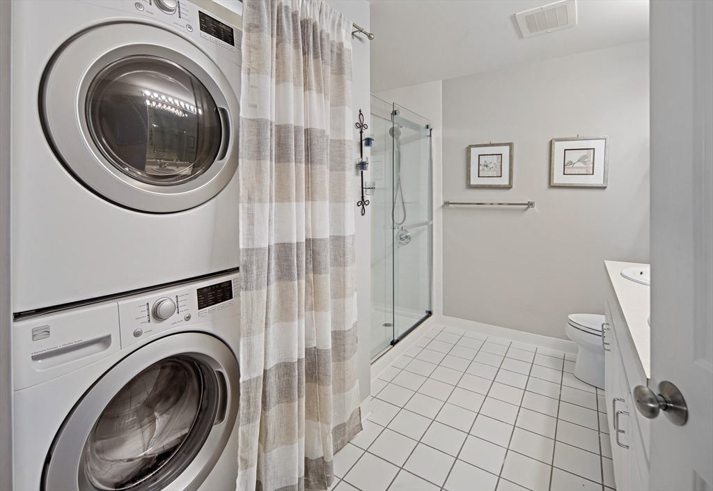 30 Franklin Street, Unit 124 Malden, MA 02148 - Photo 16 of 23 a view of a hallway with washer and dryer