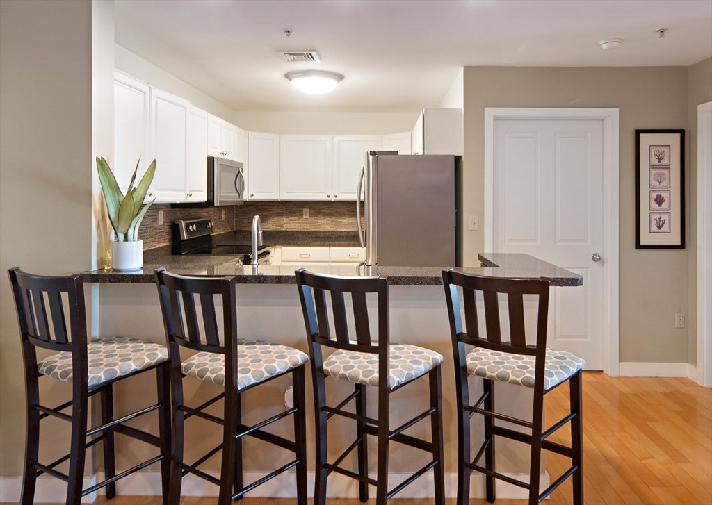 30 Franklin Street, Unit 124 Malden, MA 02148 - Photo 6 of 23 a view of a dining room with furniture