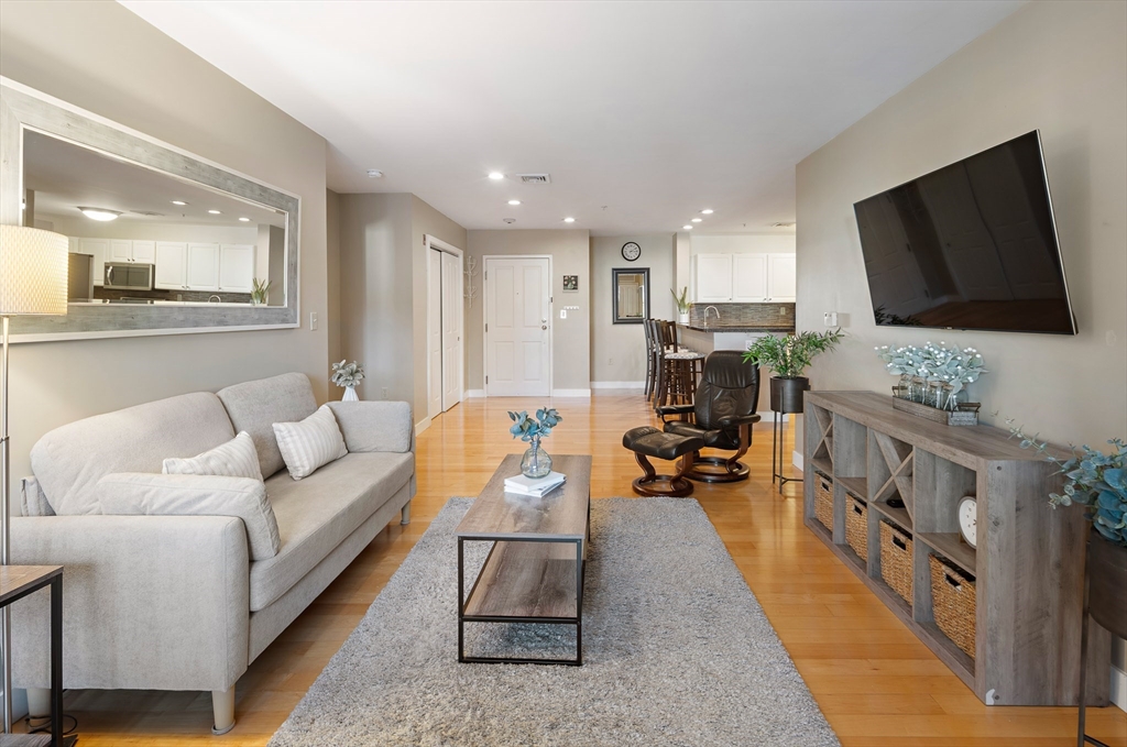 30 Franklin Street, Unit 124 Malden, MA 02148 - Photo 10 of 23 a living room with furniture and a flat screen tv