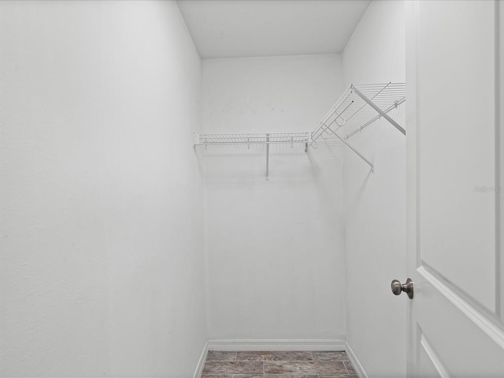 1238 Vista Way Clearwater, FL 33755 - Photo 23 of 32 a view of a room with racks on the wall