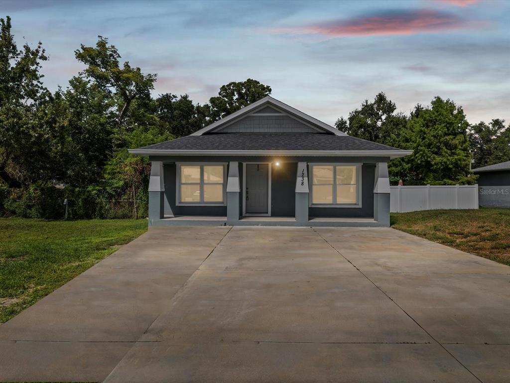 1238 Vista Way Clearwater, FL 33755 - Photo 31 of 32 a front view of a house with a yard and garage