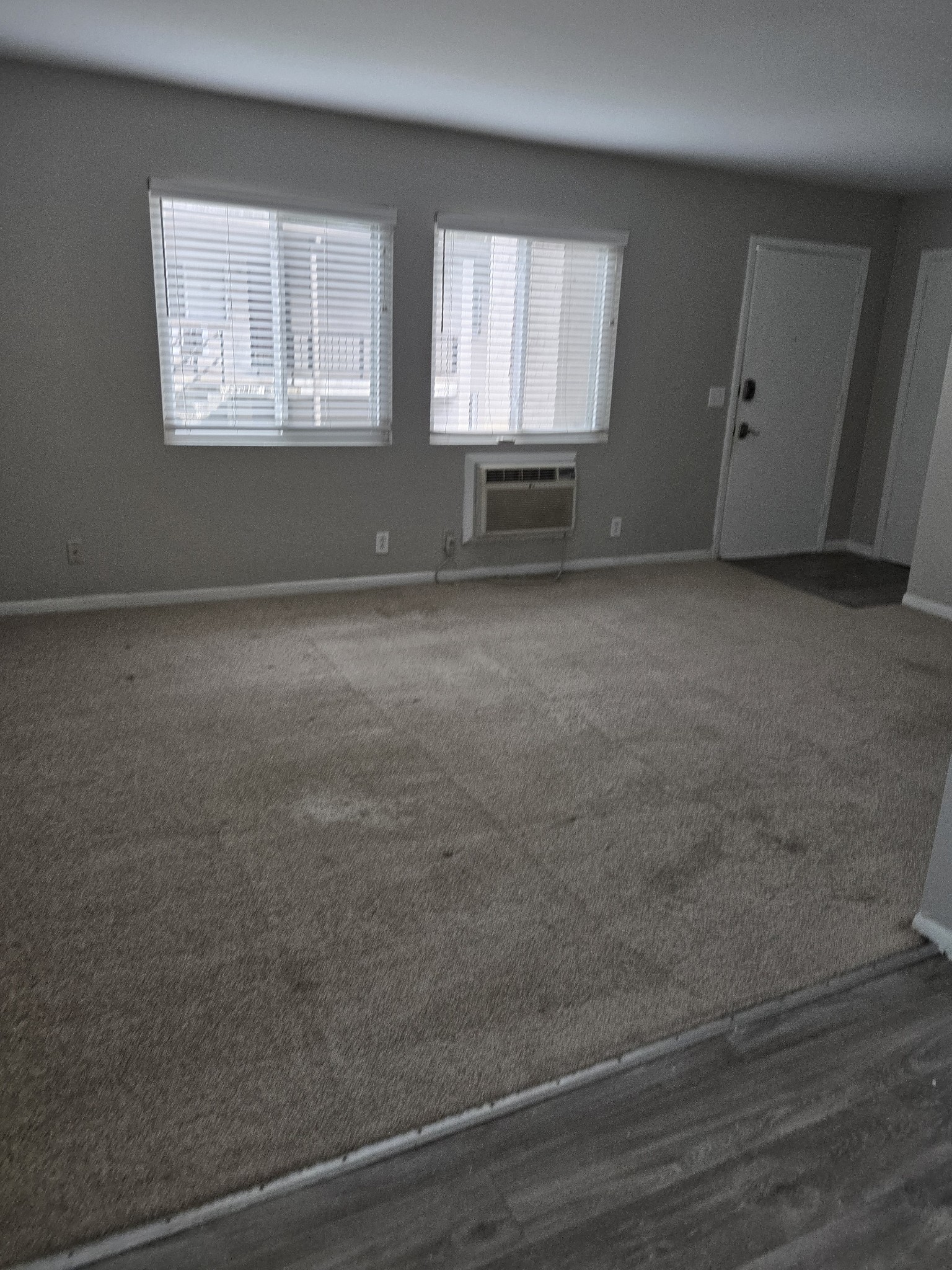 550 Harding Place, Unit E113 Nashville, TN 37211 - Photo 3 of 13 an empty room with windows