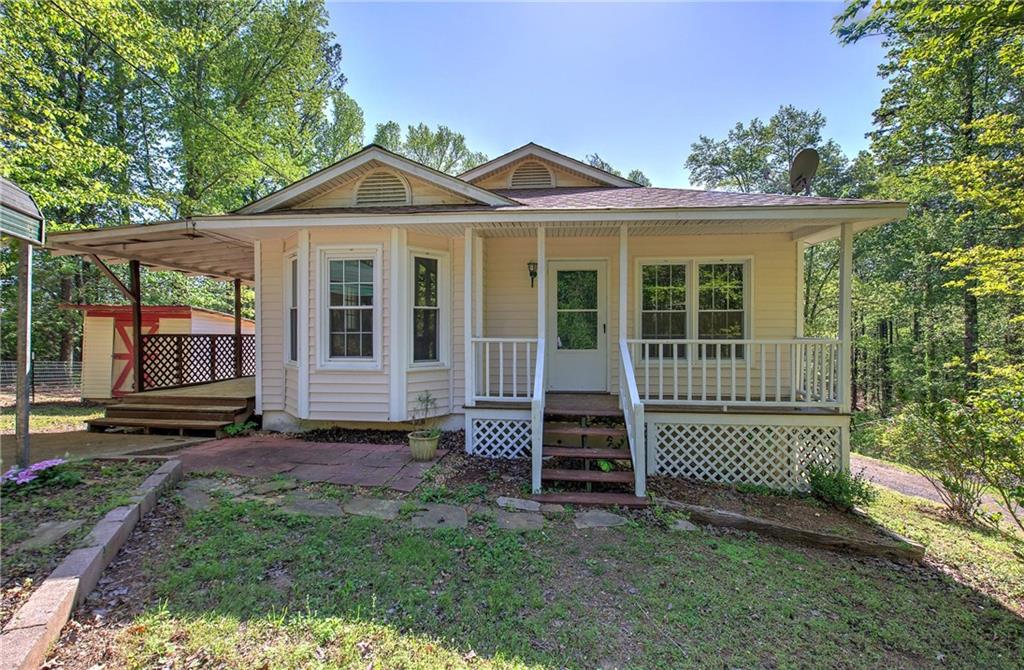 2528 Mulberry Rock Road Dallas, GA 30157 - Photo 1 of 1 a view of a house with a large window and wooden fence
