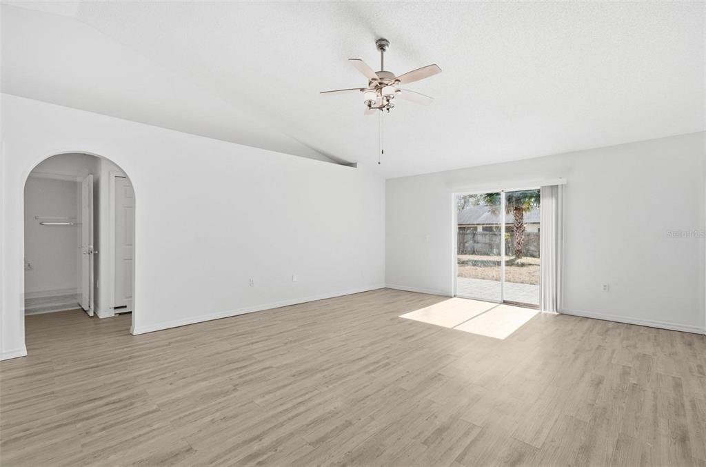 80 Providence Lane Palm Coast, FL 32164 - Photo 15 of 42 wooden floor in an empty room with a window