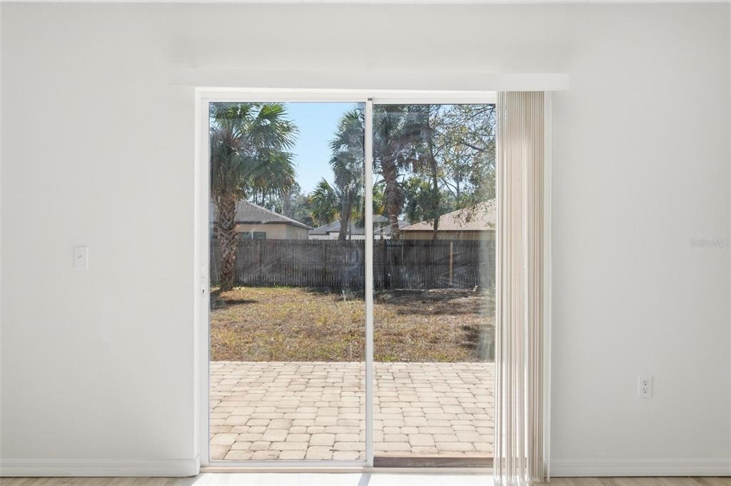 80 Providence Lane Palm Coast, FL 32164 - Photo 18 of 42 a bathroom with a glass door shower and a sink