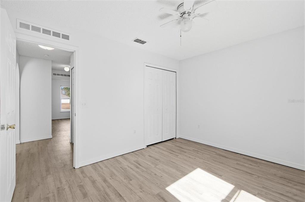80 Providence Lane Palm Coast, FL 32164 - Photo 22 of 42 wooden floor in an empty room