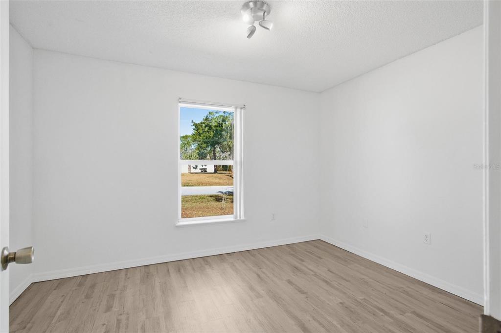 80 Providence Lane Palm Coast, FL 32164 - Photo 23 of 42 an empty room with a window