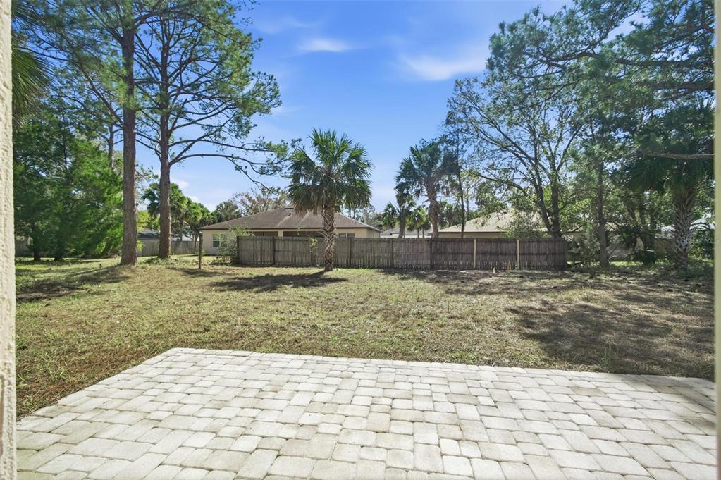 80 Providence Lane Palm Coast, FL 32164 - Photo 34 of 42 a backyard of a house with lots of green space